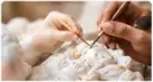 Intricate finishing details on a marble deity sculpture